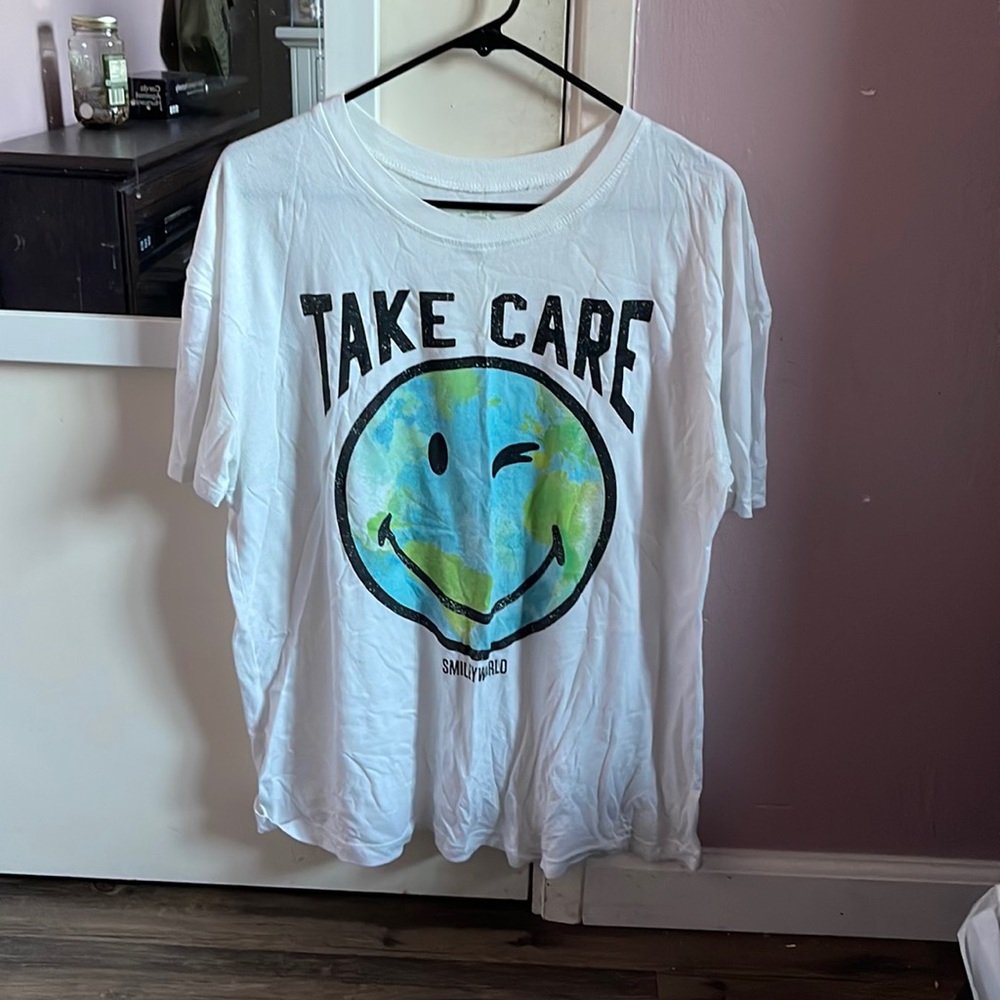 White T-shirt that has earth on it